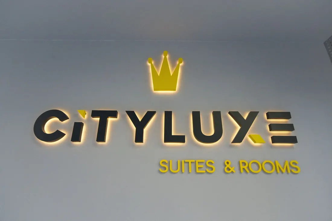 The CITYLUXE sign on the entrance wall